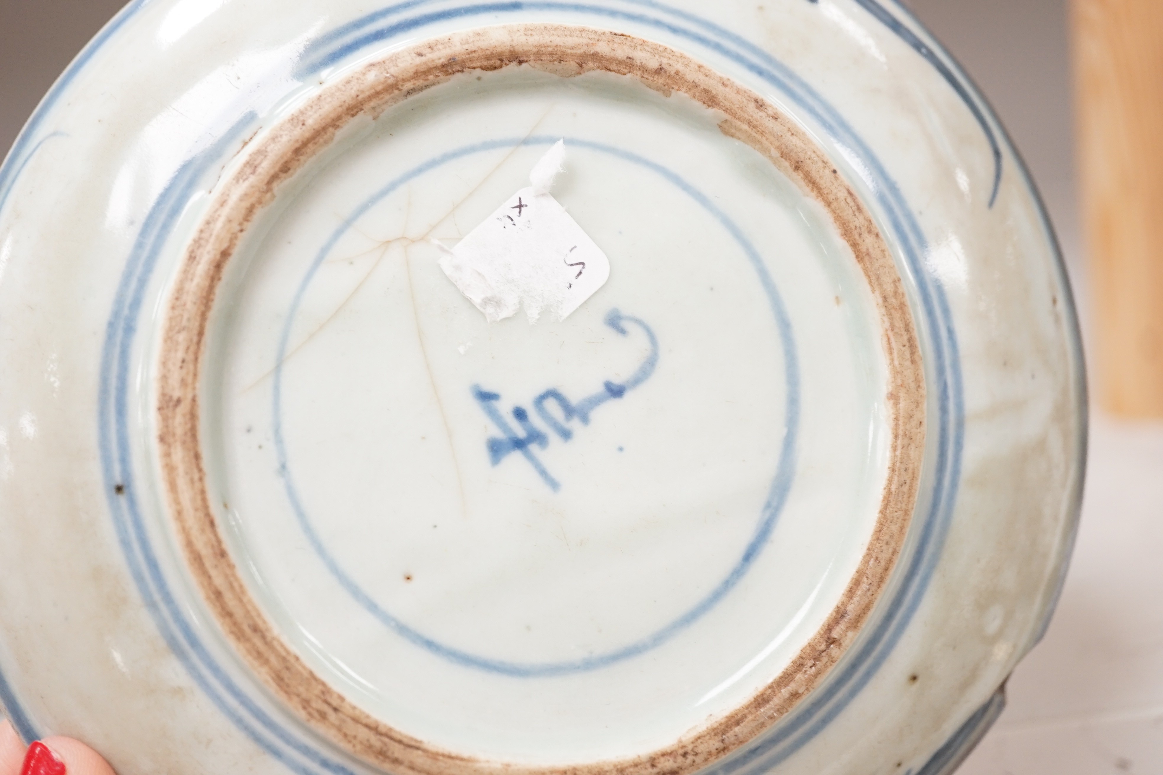 A Chinese enamelled porcelain cup stand, 15.2 cm, two Chinese blue and white plates and a small Japanese bottle vase